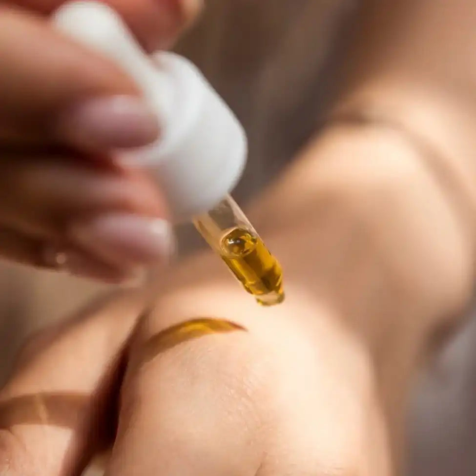 Golden liquid dropper.