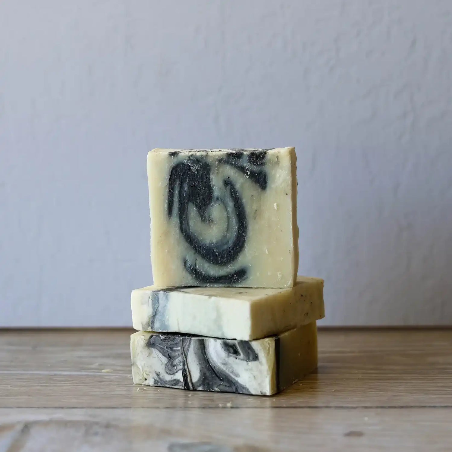 Stacked handmade soap bars.