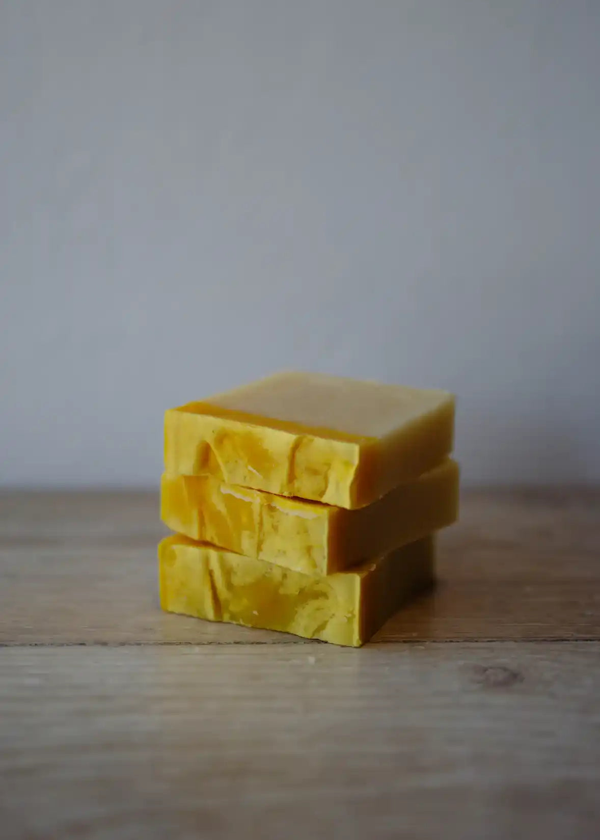 Stacked yellow soap bars.